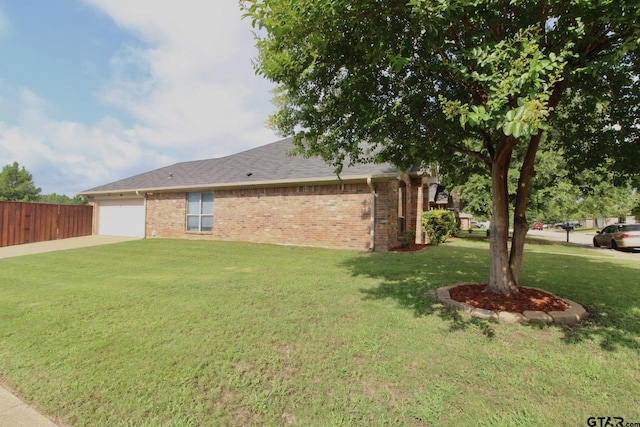 10821 Cactus Trl, Flint, TX 75762 - view of side of property featuring brick siding, concrete driveway, and an attached garage