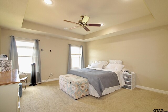 10821 Cactus Trl, Flint, TX 75762 - bedroom featuring a raised ceiling, light carpet, a ceiling fan, and recessed lighting
