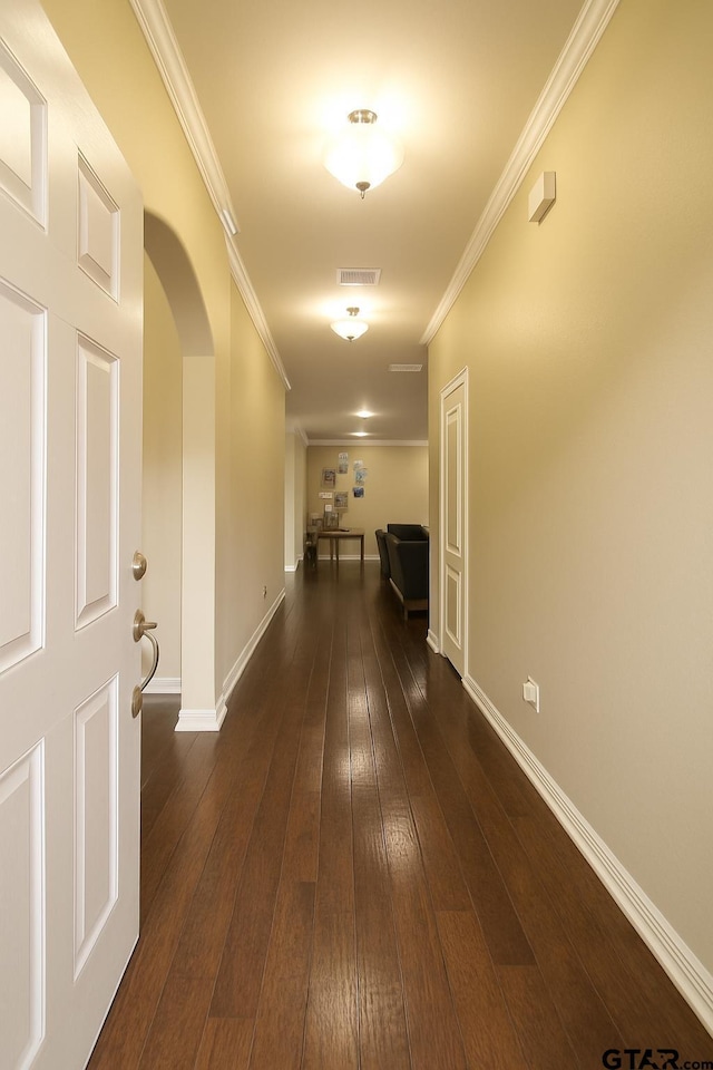 10821 Cactus Trl, Flint, TX 75762 - hall featuring arched walkways, ornamental molding, and dark wood-style flooring