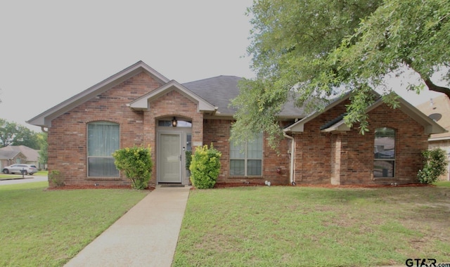 10821 Cactus Trl, Flint, TX 75762 - view of front of property featuring a front yard and brick siding