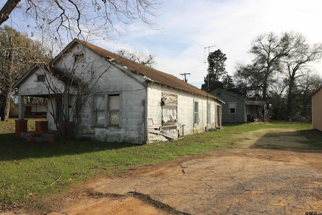 view of home's exterior featuring a lawn