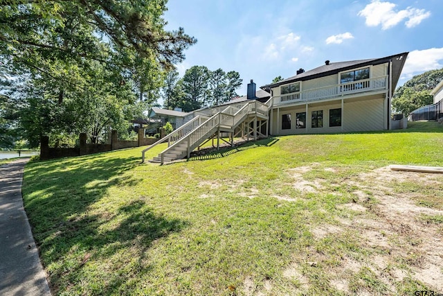 rear view of property with a yard