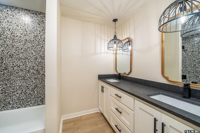 bathroom with vanity and hardwood / wood-style flooring