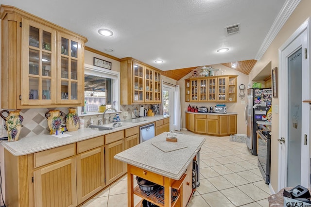 kitchen featuring a textured ceiling, lofted ceiling, and ornamental molding