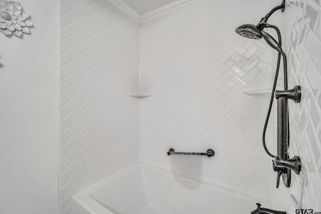 bathroom featuring tiled shower / bath and ornamental molding