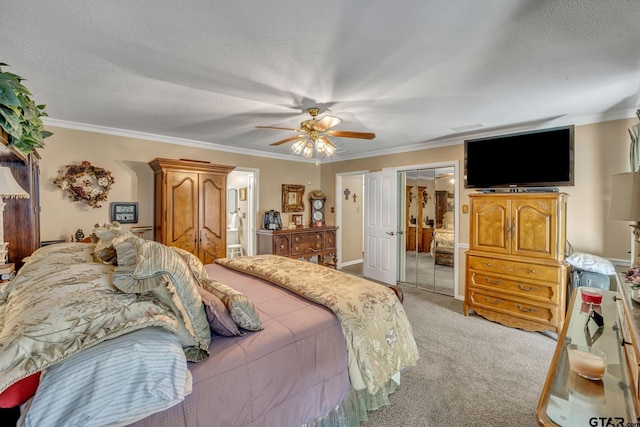 carpeted bedroom featuring a textured ceiling, ceiling fan, and crown molding