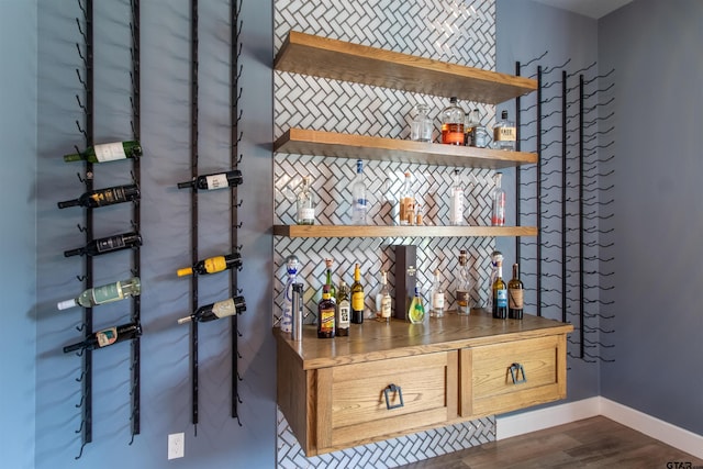 12240 Jazmin Cir, Flint, TX 75762 - indoor dry bar with dark wood-type flooring and tasteful backsplash
