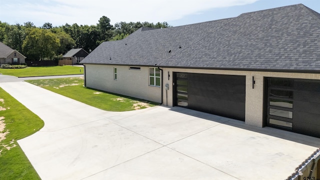 12240 Jazmin Cir, Flint, TX 75762 - view of property exterior with driveway, a shingled roof, an attached garage, and a yard