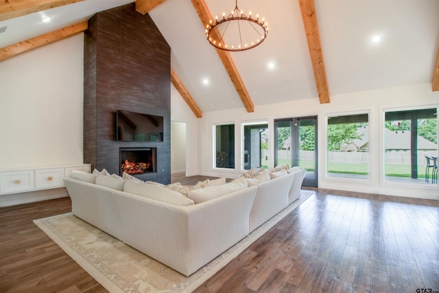 12240 Jazmin Cir, Flint, TX 75762 - living area featuring a chandelier, a large fireplace, beamed ceiling, plenty of natural light, and high vaulted ceiling