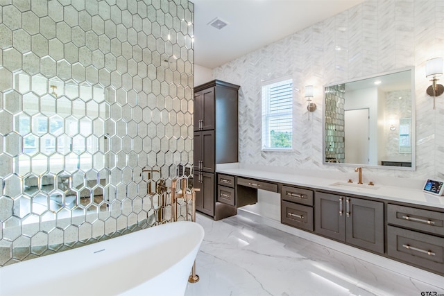 12240 Jazmin Cir, Flint, TX 75762 - bathroom with a soaking tub, vanity, wallpapered walls, and marble tiled floors