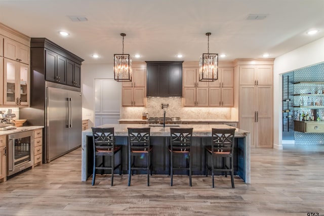 12240 Jazmin Cir, Flint, TX 75762 - kitchen featuring built in refrigerator, beverage cooler, light wood-style flooring, a chandelier, and recessed lighting