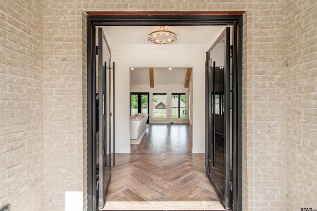12240 Jazmin Cir, Flint, TX 75762 - hall with a chandelier, ornamental molding, and brick wall