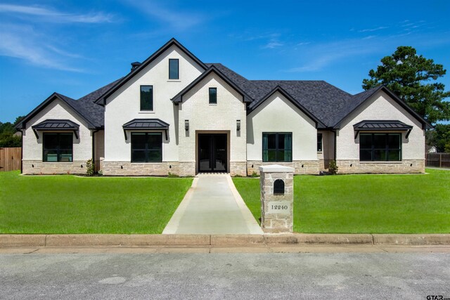 12240 Jazmin Cir, Flint, TX 75762 - french country inspired facade featuring a standing seam roof, stone siding, a shingled roof, and a metal roof