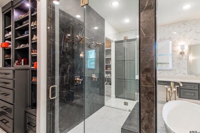 12240 Jazmin Cir, Flint, TX 75762 - bathroom with a stall shower, a freestanding bath, recessed lighting, tile walls, and vanity