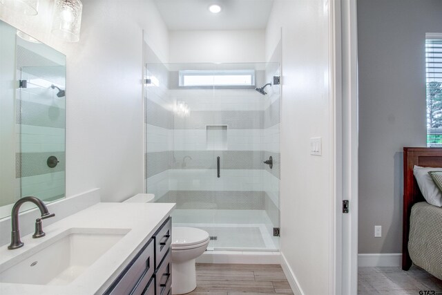 12240 Jazmin Cir, Flint, TX 75762 - full bathroom with a stall shower, vanity, and wood finished floors