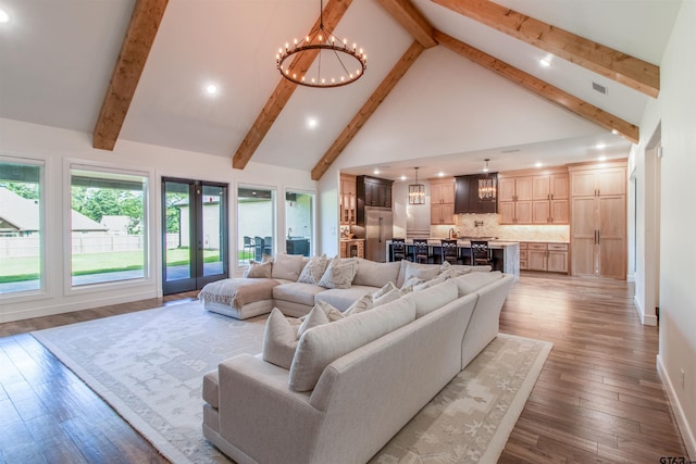 12240 Jazmin Cir, Flint, TX 75762 - living area with high vaulted ceiling, recessed lighting, a chandelier, beam ceiling, and wood finished floors