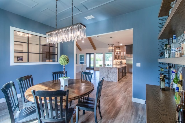 12240 Jazmin Cir, Flint, TX 75762 - dining room featuring wood finished floors and a chandelier