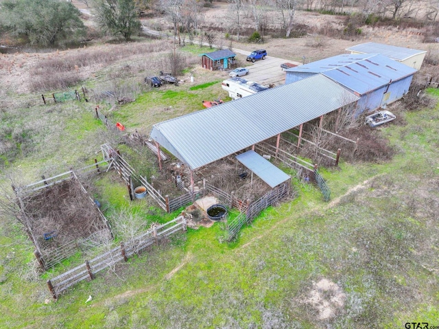 birds eye view of property featuring a rural view