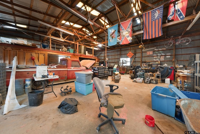 interior space with a workshop area and metal wall