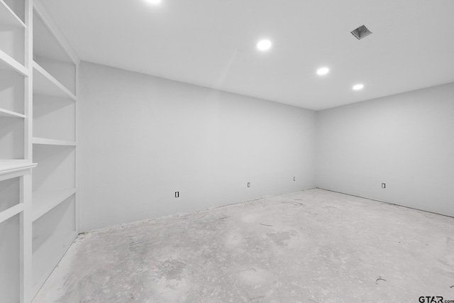 unfurnished room featuring recessed lighting and unfinished concrete flooring