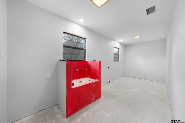 playroom with unfinished concrete floors