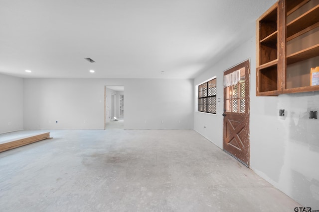 spare room with visible vents and concrete flooring