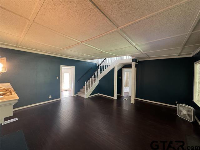 basement featuring dark wood-type flooring