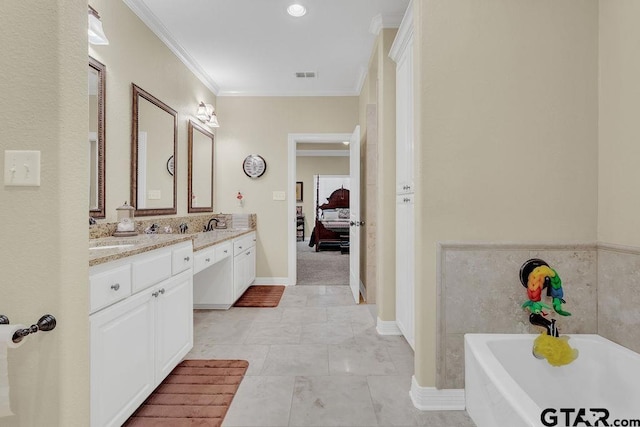 1216 Cobblestone Ct, Carthage, TX 75633 - full bathroom with double vanity, a tub to relax in, ornamental molding, and connected bathroom