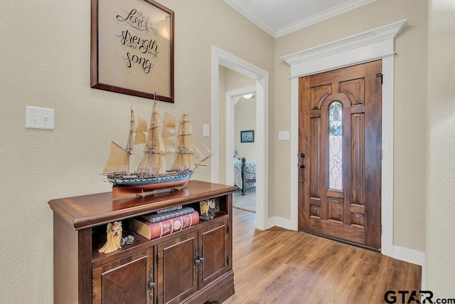 1216 Cobblestone Ct, Carthage, TX 75633 - foyer entrance featuring light wood-style flooring and ornamental molding