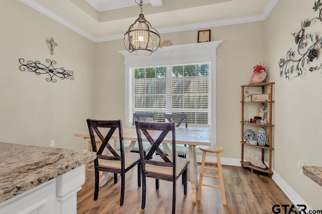 1216 Cobblestone Ct, Carthage, TX 75633 - dining area with a chandelier, wood finished floors, and ornamental molding