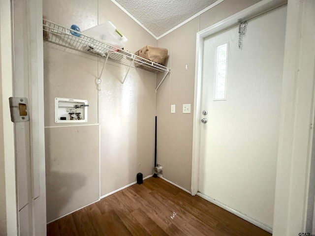 laundry room with washer hookup, a textured ceiling, crown molding, and hardwood / wood-style flooring