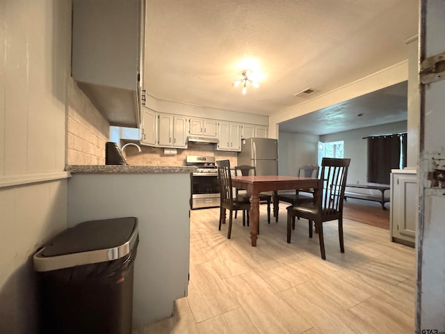 dining area with a textured ceiling