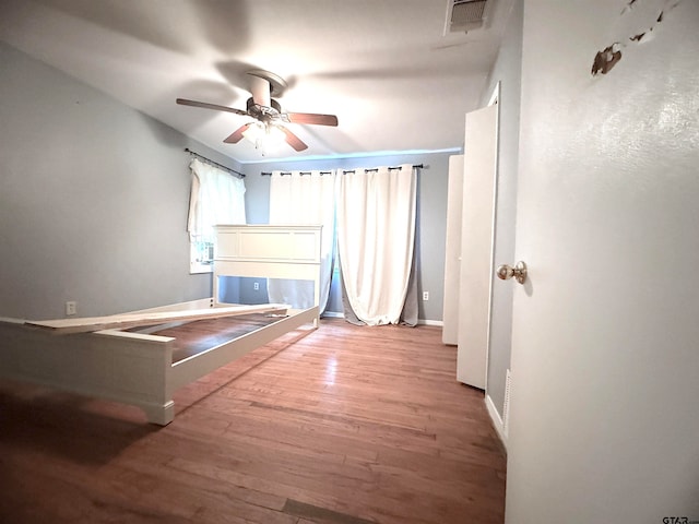 unfurnished bedroom with light hardwood / wood-style floors and ceiling fan