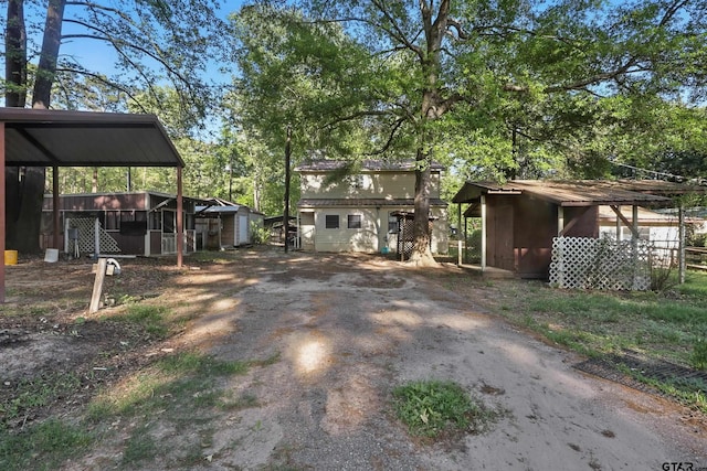 view of yard with aphalt driveway