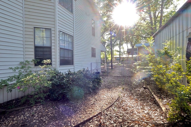 view of home's exterior with fence