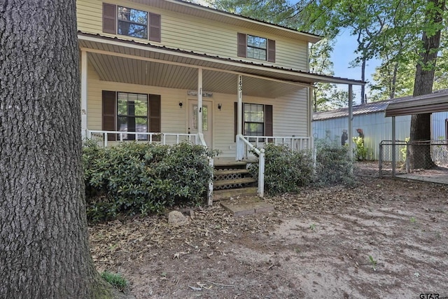 view of exterior entry with covered porch
