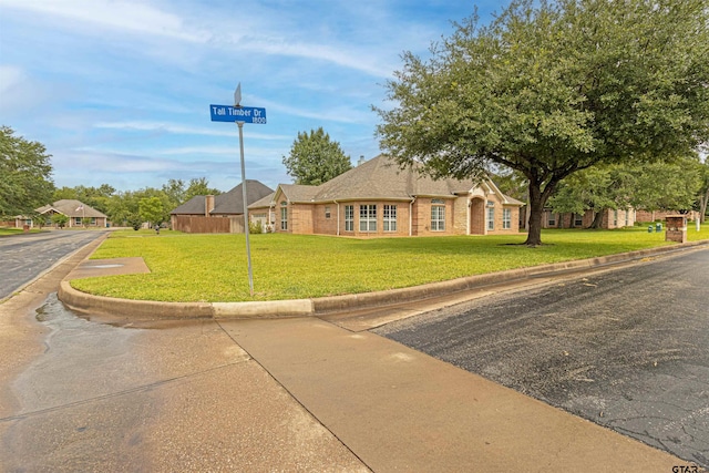 1868 Tall Timber Dr, Tyler, TX 75703 - ranch-style home with a front yard and brick siding