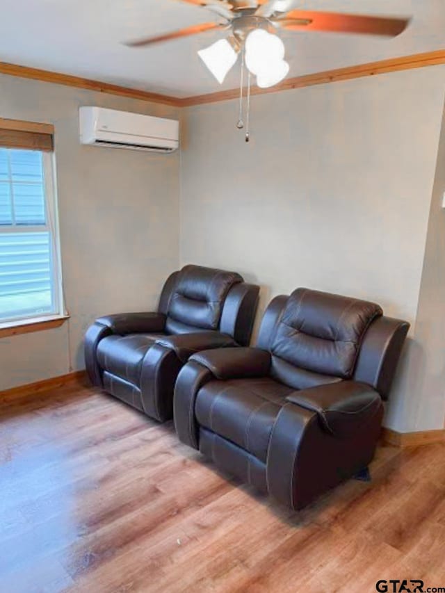 living room with light hardwood / wood-style floors, a wall mounted AC, crown molding, and ceiling fan