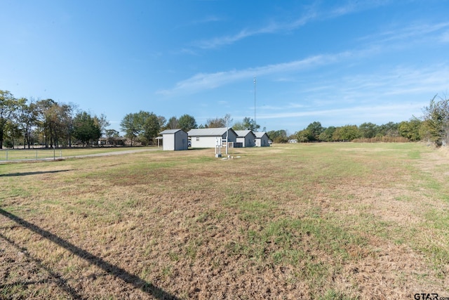 view of yard with a rural view