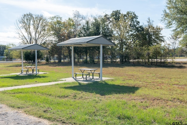 view of home's community with a lawn