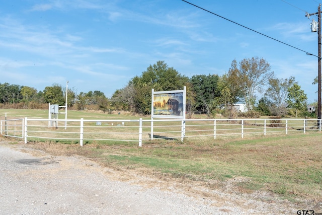 view of yard with a rural view