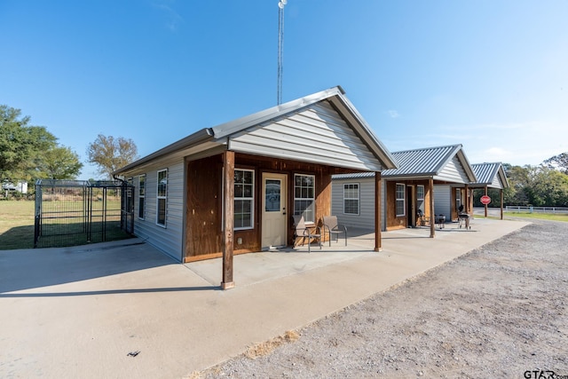 back of property with a patio area