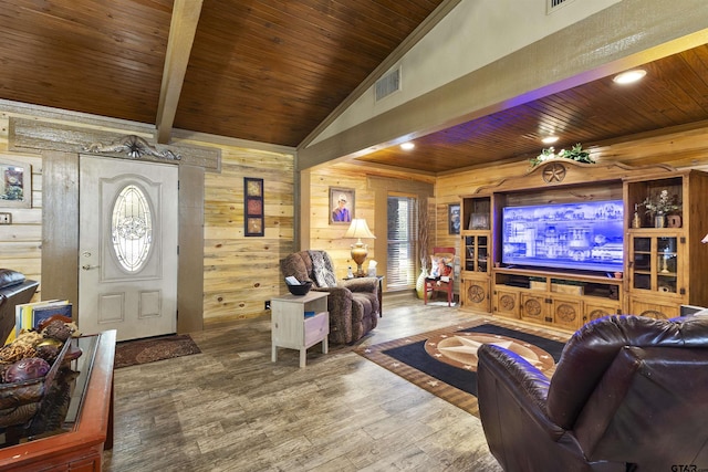 living room with hardwood / wood-style flooring, wood ceiling, vaulted ceiling with beams, and wooden walls