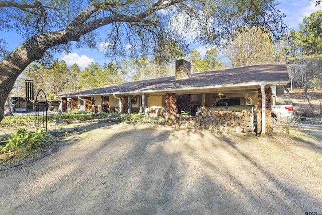 ranch-style home featuring a carport