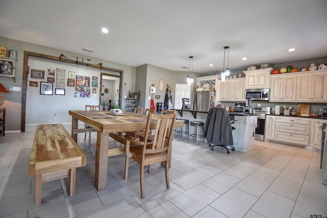 dining space with light tile patterned floors, visible vents, and recessed lighting