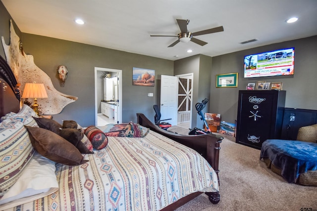 carpeted bedroom featuring a ceiling fan, recessed lighting, visible vents, and ensuite bath