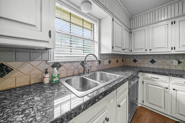 5806 Plantation Dr, Tyler, TX 75703 - kitchen with a sink, dishwasher, white cabinets, and decorative backsplash