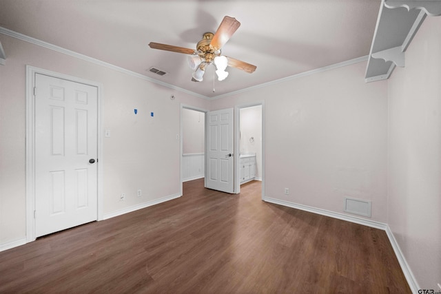 5806 Plantation Dr, Tyler, TX 75703 - unfurnished bedroom with wood finished floors, baseboards, crown molding, and ensuite bathroom