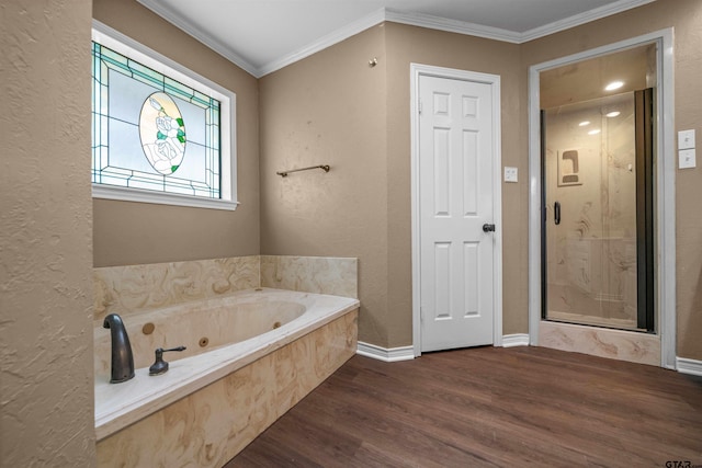 5806 Plantation Dr, Tyler, TX 75703 - bathroom with wood finished floors, a whirlpool tub, ornamental molding, baseboards, and a textured wall