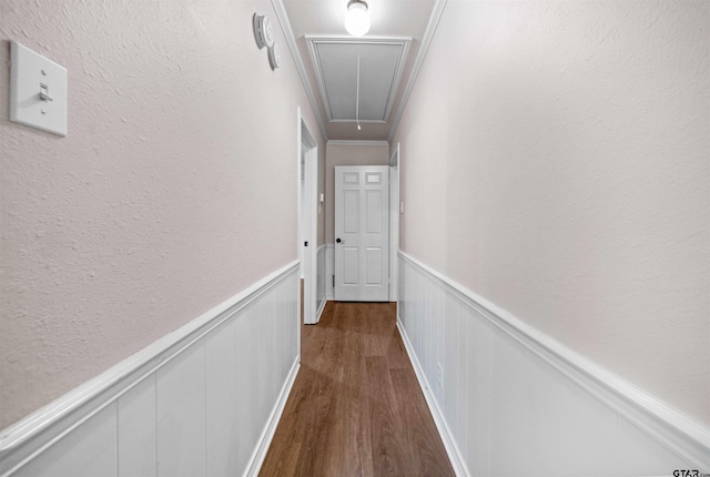 5806 Plantation Dr, Tyler, TX 75703 - corridor featuring attic access, dark wood-style floors, and a wainscoted wall
